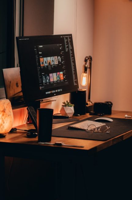 black-flat-screen-computer-monitor-on-brown-wooden-desk