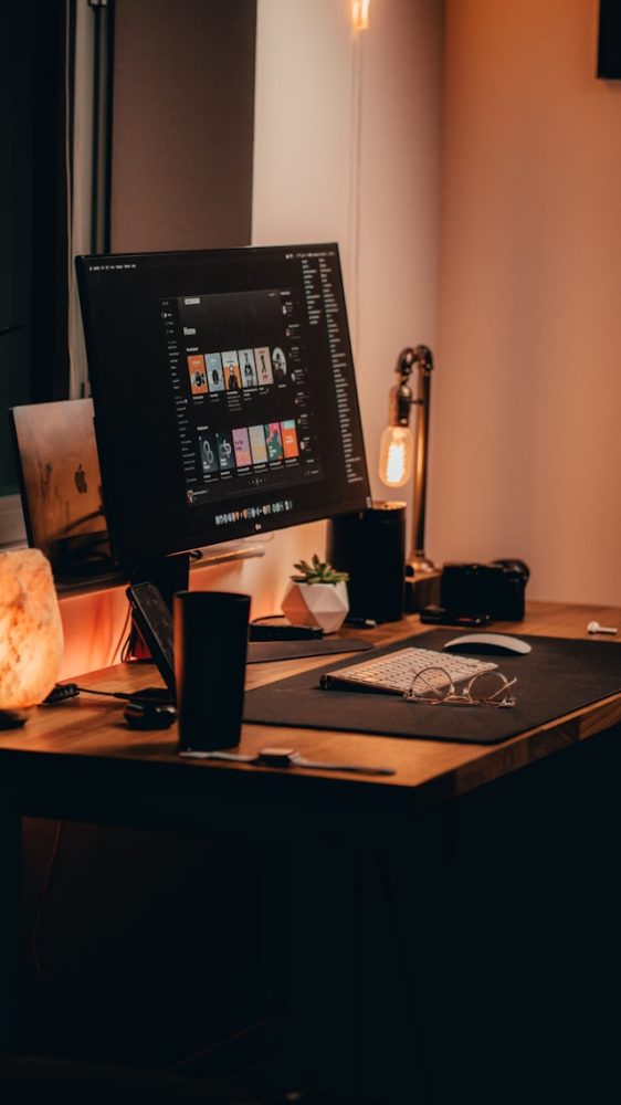 black-flat-screen-computer-monitor-on-brown-wooden-desk